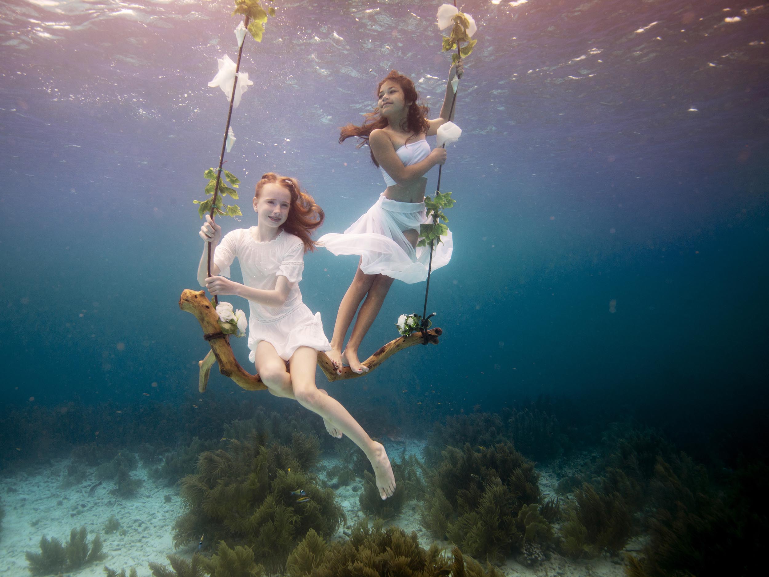 underwater photoshoot on a underwater swing on bonaire